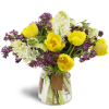 With Tulips on Top™ - Deluxe. An arrangement by Avenue Flowers and Gifts. Sunny yellow tulips and fragrant lilacs and hyacinth are arranged in...