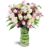 Sweetest Valentine™ - Premium. An arrangement by Avenue Flowers and Gifts. Roses and spray roses are arranged with tulips, lisianthus, and more in...