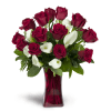 Full of Love™ - Deluxe. An arrangement by Avenue Flowers and Gifts. Classic red roses and mini Calla lilies are elegantly arranged in a glass...