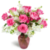 Sweet on You Bouquet™ - Deluxe. An arrangement by Avenue Flowers and Gifts. Hot pink roses are arranged with delicate white stock and charming...