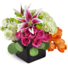 Vibrant Delight™ - Deluxe. An arrangement by Avenue Flowers and Gifts. Roses, tulips, hydrangea, and more are arranged in a ceramic vase. Upgrade...